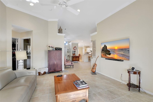 living room featuring light tile patterned floors, baseboards, ornamental molding, and recessed lighting