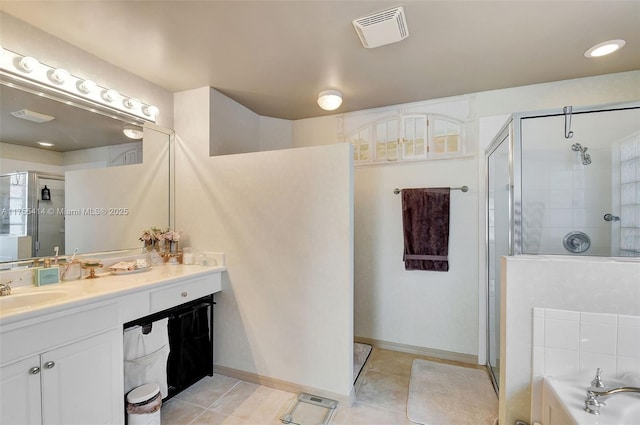 full bathroom featuring a shower stall, visible vents, and vanity