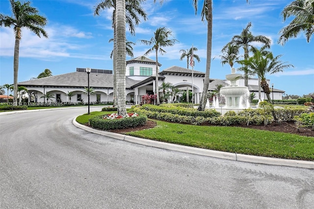 view of property featuring curved driveway