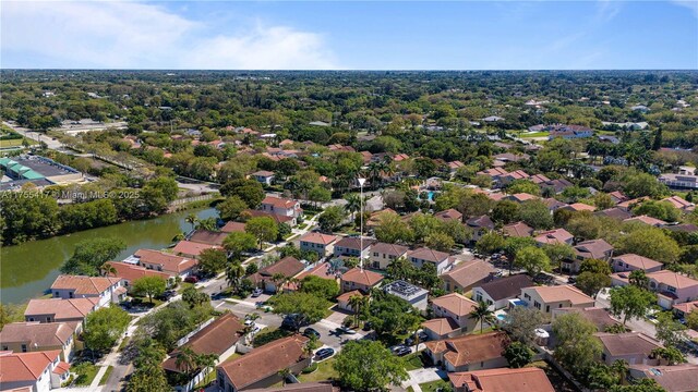 drone / aerial view with a residential view and a water view