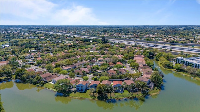 bird's eye view with a residential view and a water view