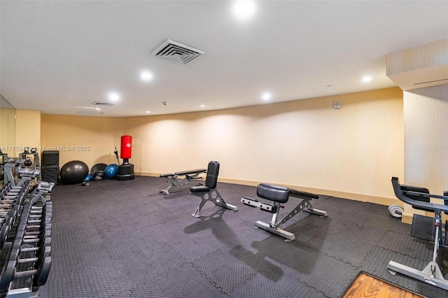 workout area with recessed lighting, visible vents, and baseboards