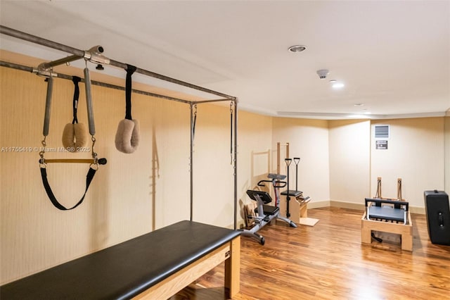 exercise area with wood finished floors