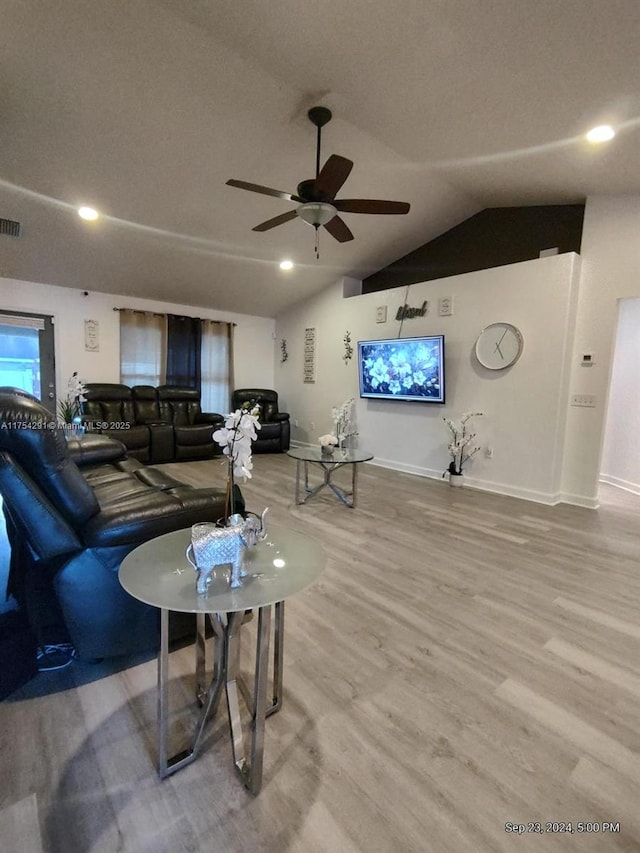 living room with ceiling fan, vaulted ceiling, recessed lighting, wood finished floors, and baseboards