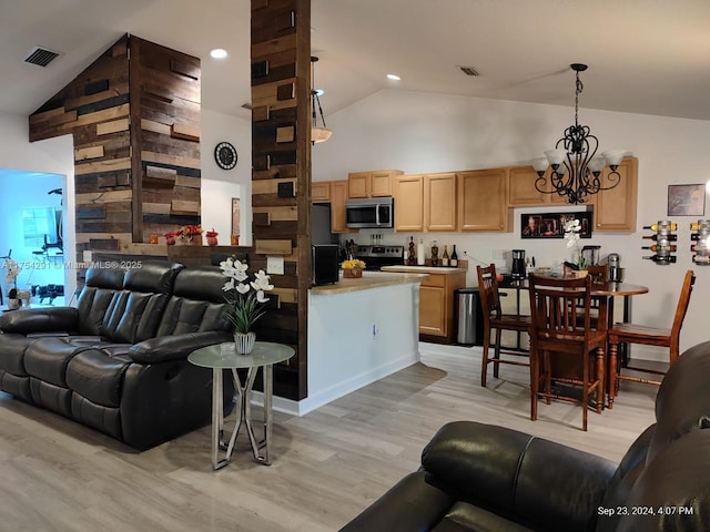 living room featuring an inviting chandelier, recessed lighting, light wood-style flooring, visible vents, and high vaulted ceiling