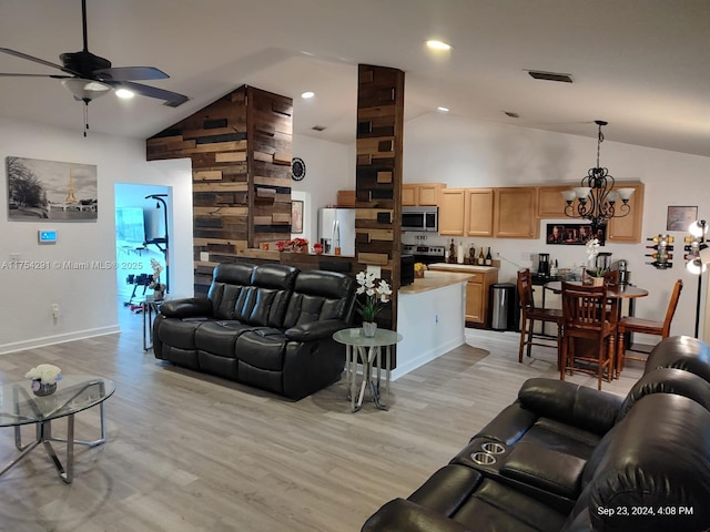 living room with ceiling fan with notable chandelier, high vaulted ceiling, light wood-type flooring, visible vents, and recessed lighting