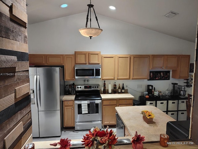 kitchen with high vaulted ceiling, light countertops, decorative light fixtures, visible vents, and stainless steel appliances