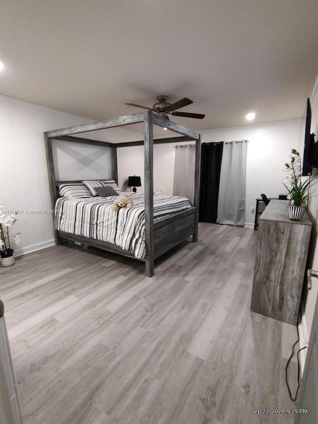 bedroom featuring recessed lighting, baseboards, a ceiling fan, and wood finished floors