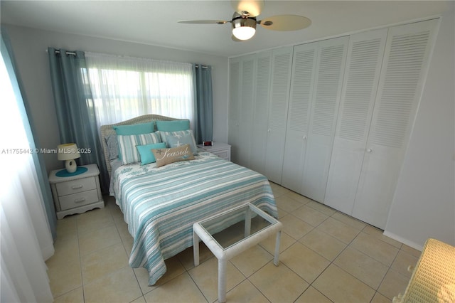 bedroom featuring light tile patterned floors and a ceiling fan