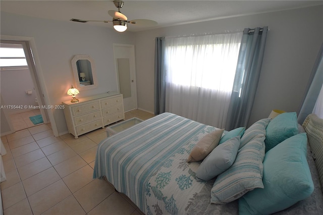 bedroom with visible vents, ceiling fan, and light tile patterned floors