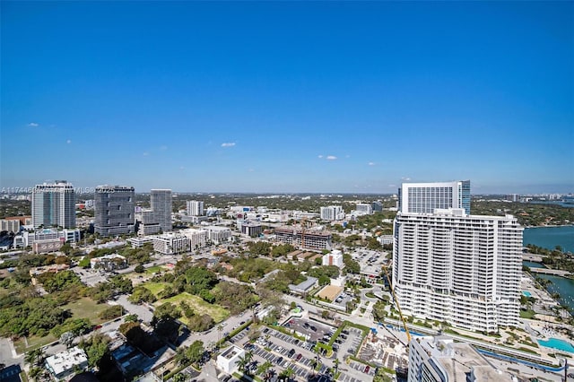 birds eye view of property with a view of city and a water view