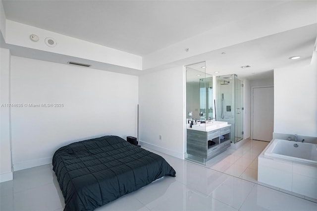 bedroom with light tile patterned floors, baseboards, visible vents, and ensuite bathroom