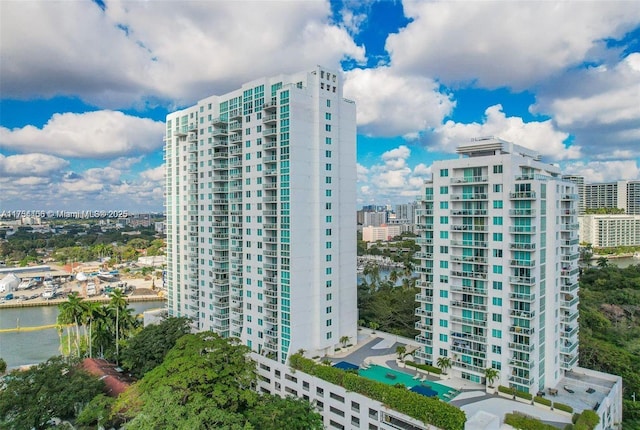 view of property featuring a water view and a city view