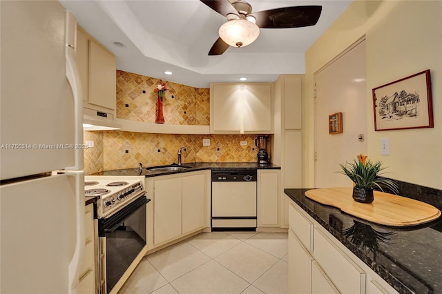 3111 N Ocean Dr Unit 508, Hollywood, FL 33019 - kitchen with white appliances, a sink, under cabinet range hood, tasteful backsplash, and light tile patterned flooring