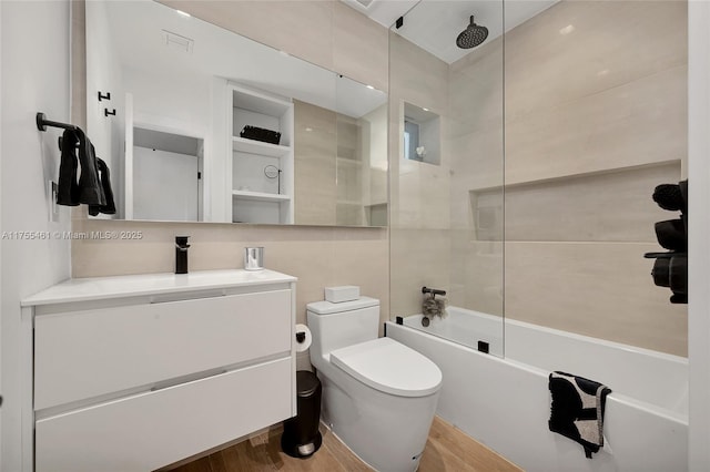 full bath featuring toilet, visible vents, wood finished floors, and a combined bath / shower with rainfall shower