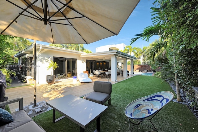 view of patio / terrace featuring outdoor dining space, fence, and an outdoor hangout area