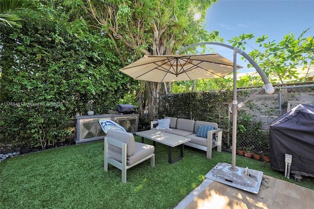 view of patio with a fenced backyard, an outdoor living space, and area for grilling