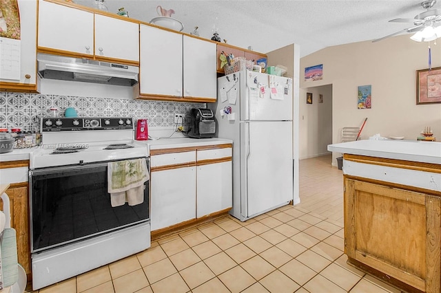 kitchen with white appliances, vaulted ceiling, light countertops, under cabinet range hood, and white cabinetry