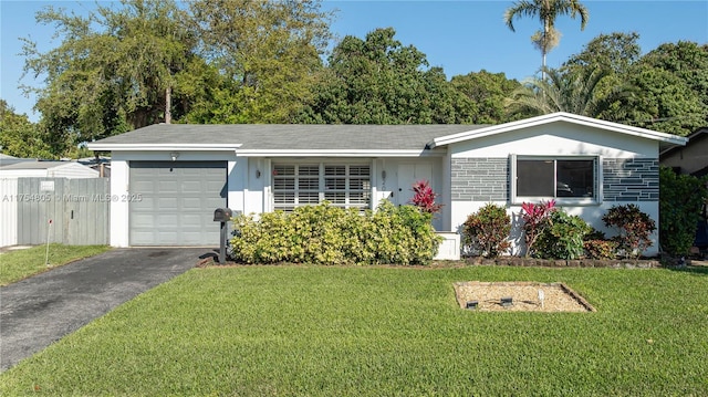 ranch-style home with aphalt driveway, a garage, stone siding, stucco siding, and a front yard