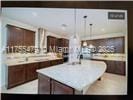 kitchen with a kitchen island and light countertops