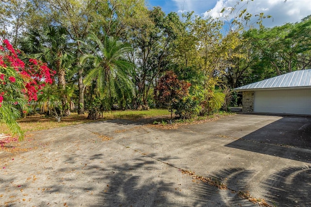 view of yard featuring a garage