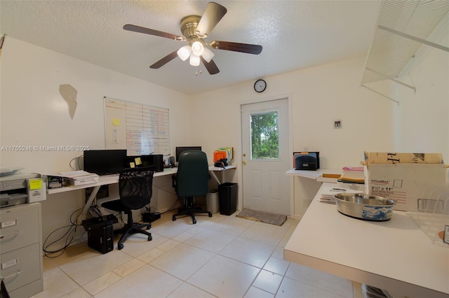 office area featuring a textured ceiling, light tile patterned floors, and a ceiling fan