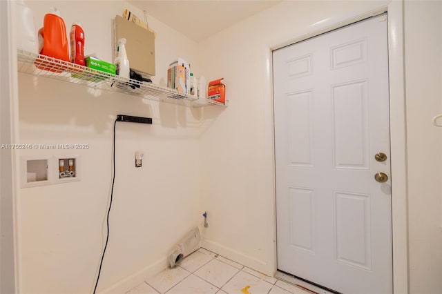 washroom with laundry area, light tile patterned flooring, hookup for a washing machine, and baseboards