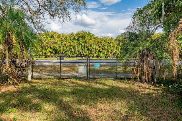 view of gate with fence