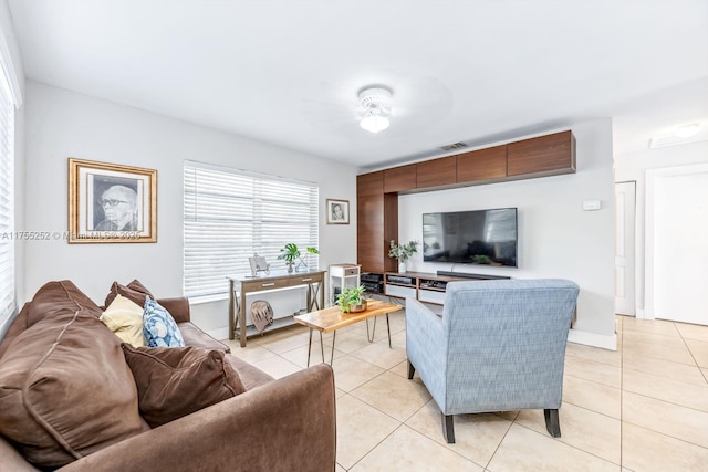 living room featuring visible vents and light tile patterned floors