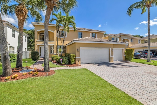 view of front of home featuring decorative driveway, stucco siding, fence, a garage, and a front lawn