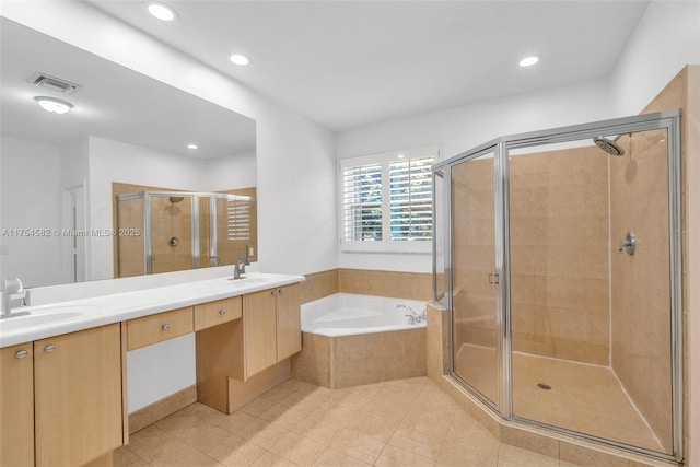 full bath featuring a sink, visible vents, a bath, double vanity, and a stall shower