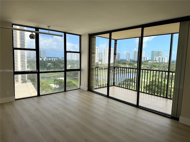 unfurnished sunroom featuring a city view