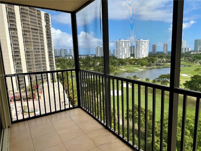 balcony with a water view and a city view