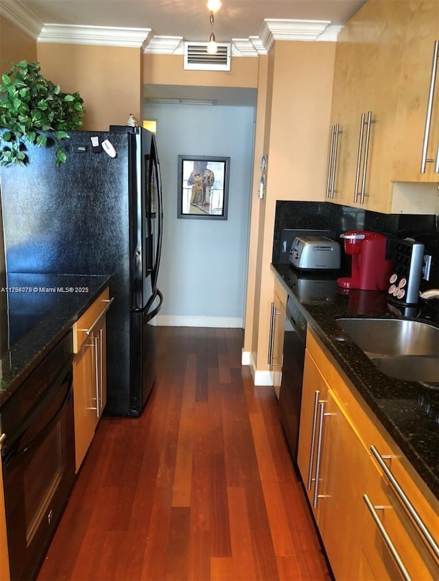 kitchen with black appliances, dark wood-style floors, a sink, and ornamental molding