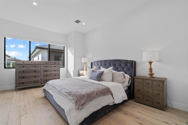 bedroom featuring recessed lighting, light wood-style floors, visible vents, and baseboards