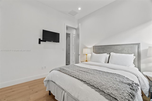 bedroom featuring visible vents, recessed lighting, wood finished floors, and baseboards