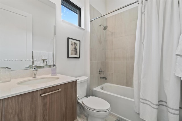 full bath with vanity, toilet, and shower / tub combo