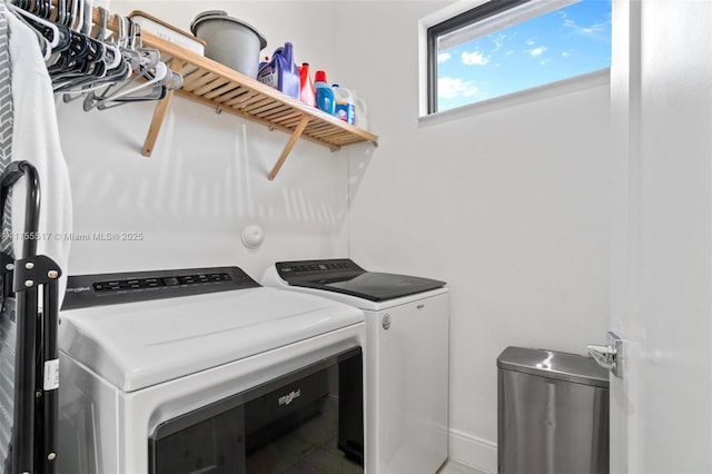 clothes washing area with laundry area and washer and clothes dryer