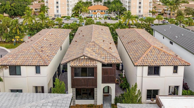 view of front of home featuring stucco siding and a tiled roof