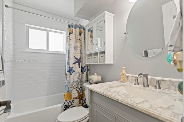 bathroom featuring shower / tub combo, vanity, and toilet