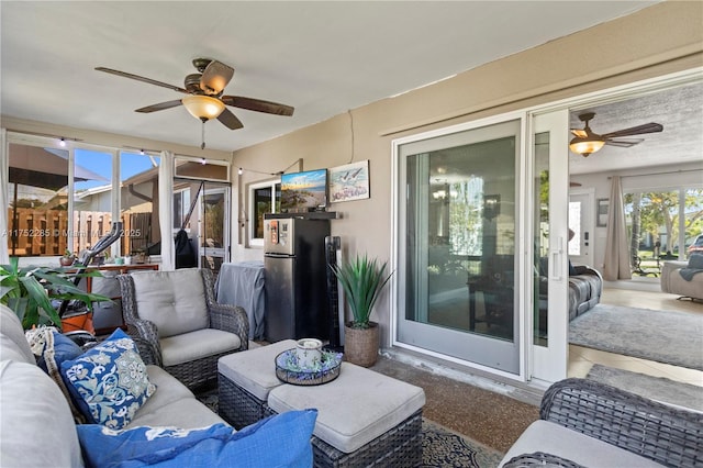 sunroom / solarium with ceiling fan