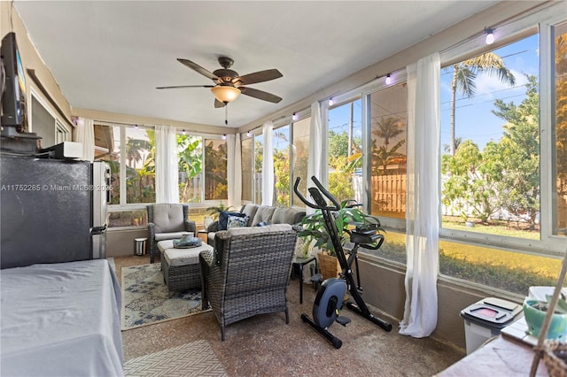 sunroom with a ceiling fan