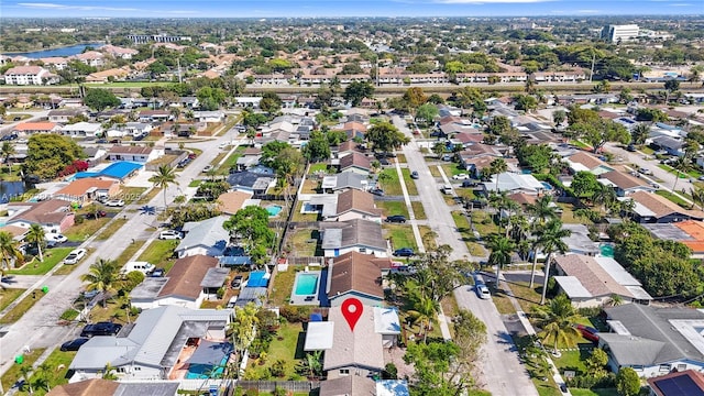 aerial view featuring a water view and a residential view