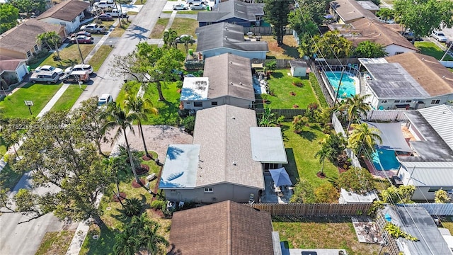 birds eye view of property with a residential view