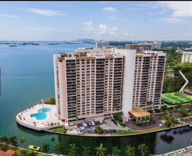 birds eye view of property featuring a water view and a view of city