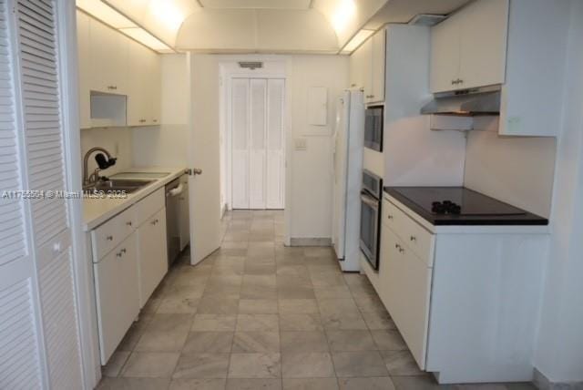 kitchen with wall oven, black electric cooktop, under cabinet range hood, a sink, and stainless steel dishwasher