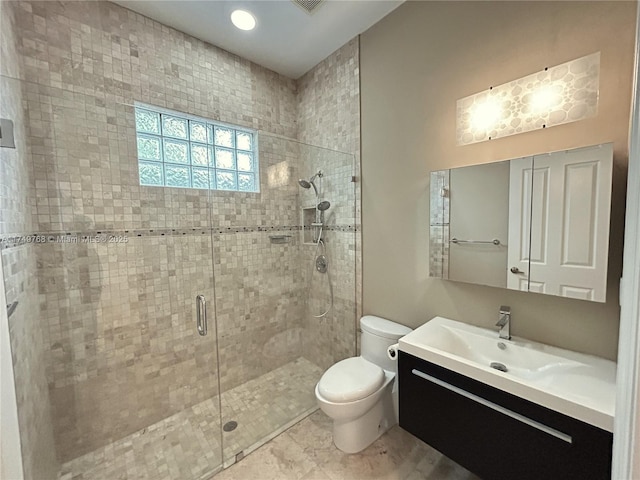 full bath featuring toilet, a shower stall, and vanity