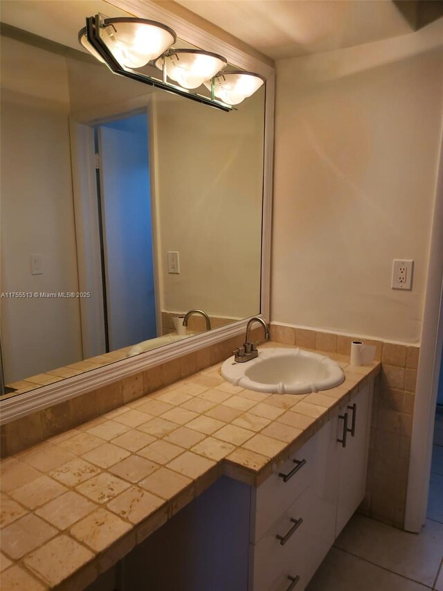 851 NE 14th Ave Unit 414, Hallandale Beach, FL 33009 - bathroom with vanity and tile patterned flooring