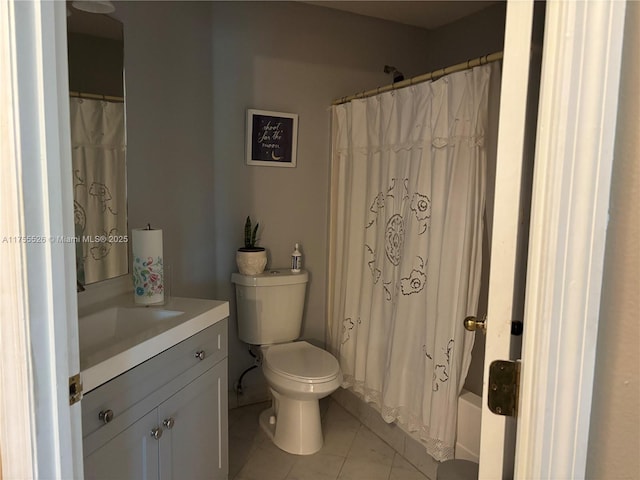 full bathroom featuring tile patterned floors, toilet, and vanity