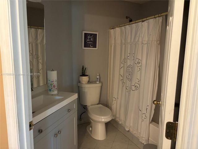 bathroom featuring tile patterned floors, toilet, and vanity